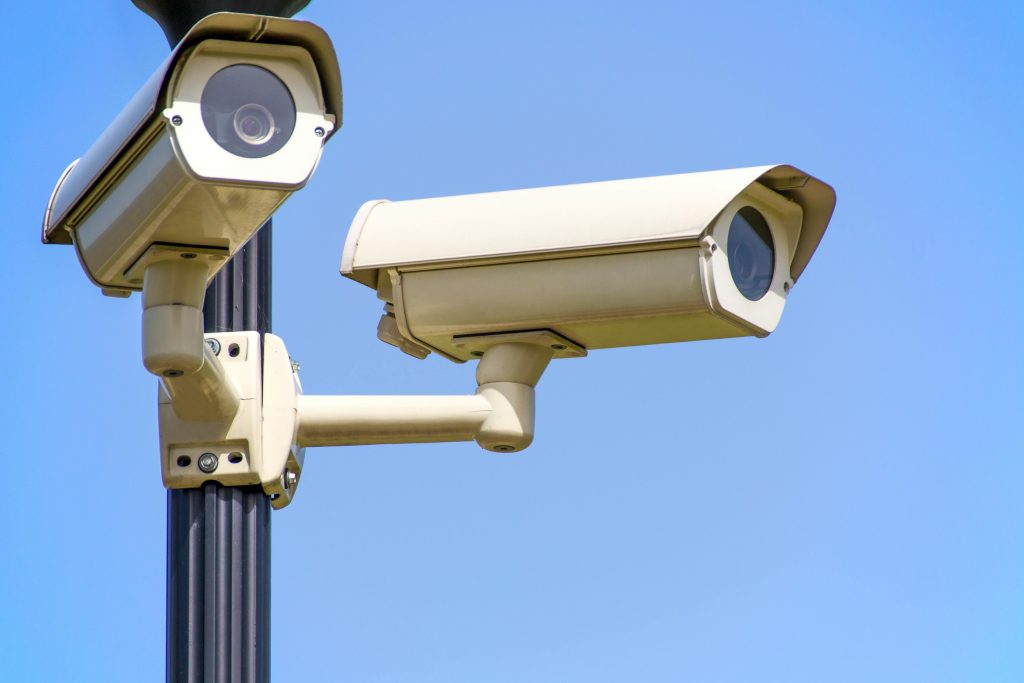 White 2 Cctv Camera Mounted on Black Post Under Clear Blue Sky as FIND-GH Equips UCC Security Personnel 